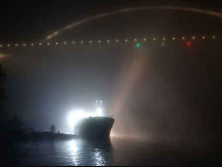 Norwegian Cargo Ship Grounds in Heavy Fog Under a Bridge
