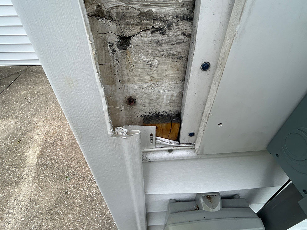 White siding with visible damage and a close-up section of the structure