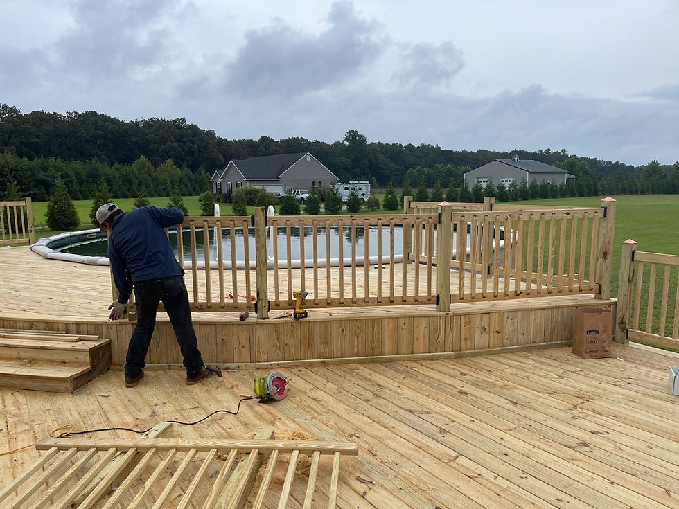Man building deck around pool Wood Deck Contruction with green nature background