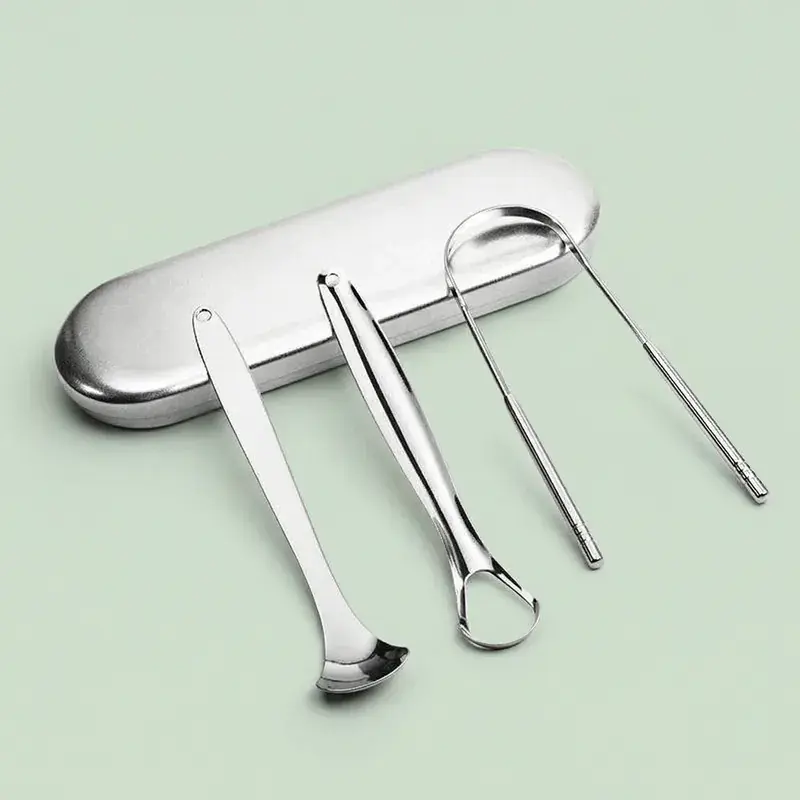 Four stainless steel earwax removal tools with case on light green background.