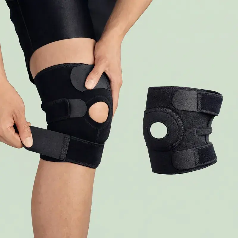 Person adjusting black orthopedic knee brace; another brace displayed.
