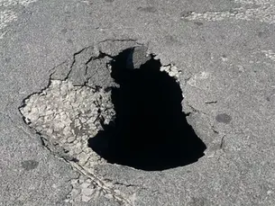 Key Swansea road partially closed after sinkhole appears