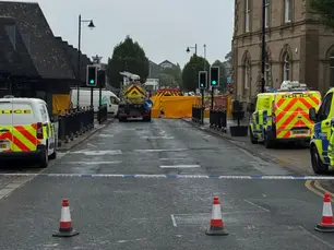 Woman dies after being hit by road sweeper