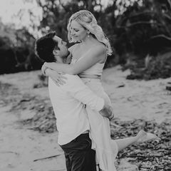 Romantic couple embracing on the beach at golden hour Sarina beach