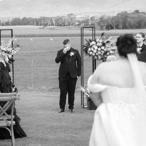 Note Park wedding Mackay photographer bride walking down the aisle to the groom wiping away tears of joy