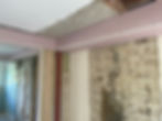 Exposed brick wall during structural alterations.