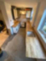 Kitchen structural alterations with new wooden countertops.