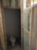 Small WC room stripped back to timber studs with the toilet still in place
