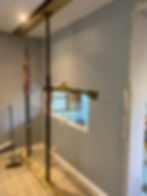 Structural alterations showing wall support props during a remodel.