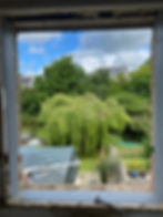 Window structural alterations showing a garden view