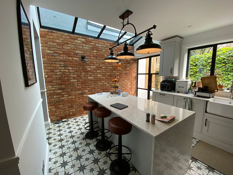 Bespoke kitchen renovations with island and brick wall