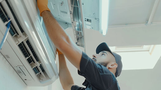 focused-technician-wearing-cap-gloves-works-indoor-air-conditioning-unit-showcasing-precis