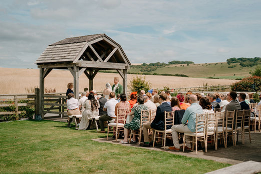 outdoor wedding ceremony at long furlong barn in worthing
