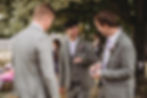 groom and groomsmen before the wedding ceremony at iford hall in sussex, dressed in tweed suits and lilac ties