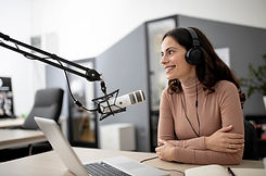 woman-radio-studio-with-microphone-laptop.jpg