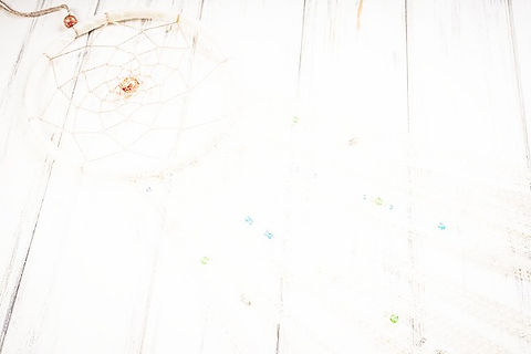 depositphotos_355423786-stock-photo-dream-catcher-wooden-background_edited.jpg