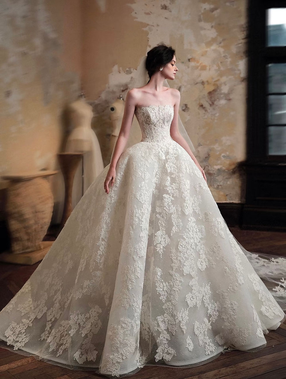 Strapless floral lace bridal gown with full ball gown skirt.