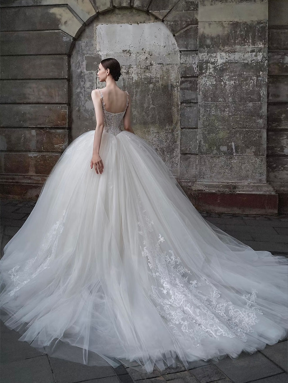 Thumbnail: Corset tulle bridal gown with straps and full ball gown skirt.