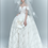 Thumbnail: Lace ball gown bridal dress with corset bodice and floral off-shoulder straps.