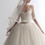 Thumbnail: Sweetheart tulle bridal ball gown with ruched bodice and off-the-shoulder sheer sleeves.