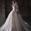 Thumbnail: Satin and lace bridal gown with folded neckline and floral appliqué skirt.