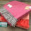 Thumbnail: Tweedmill Textiles bright pink grey herringbone knee blanket