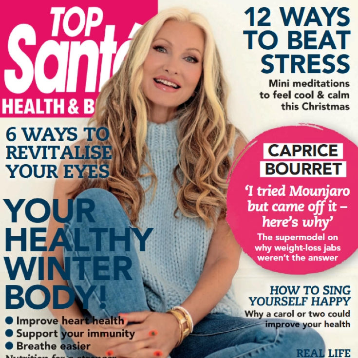 Fitness magazine cover featuring a smiling woman in activewear