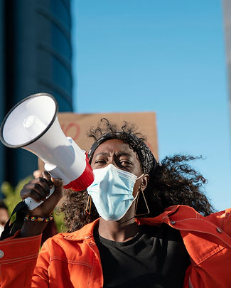 close-up-woman-with-megaphone-wearing-mask.jpg