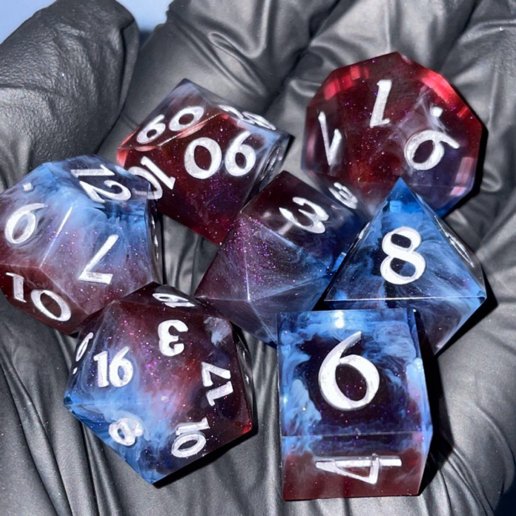 Hand holding red and blue swirled portal effect dice with numbers.