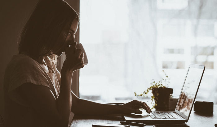 A woman working on a laptop