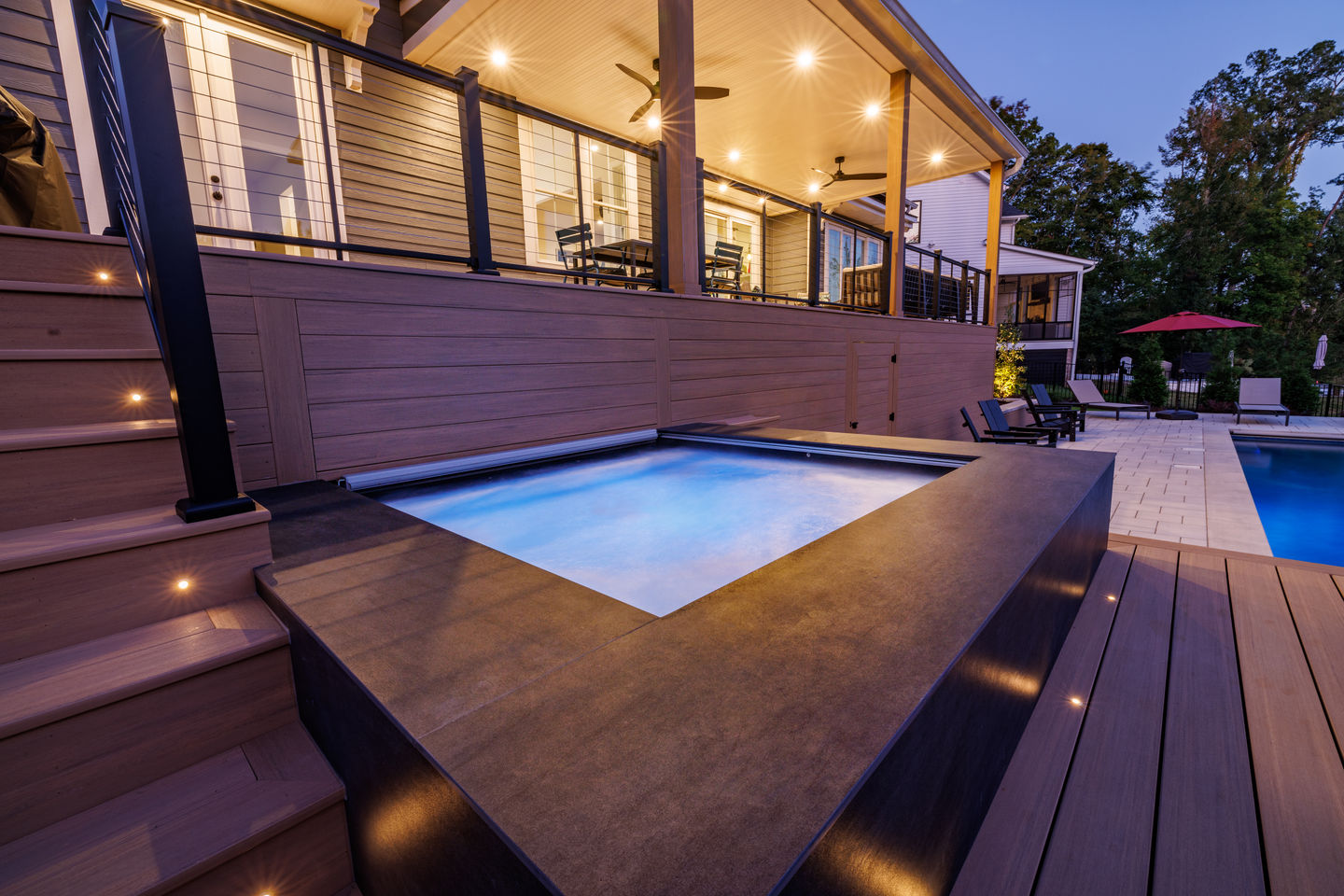 a house with a large deck and a swimming pool