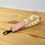 Thumbnail: Individual pig print wristlet, pink pig with yellow background and complementary pink cotton