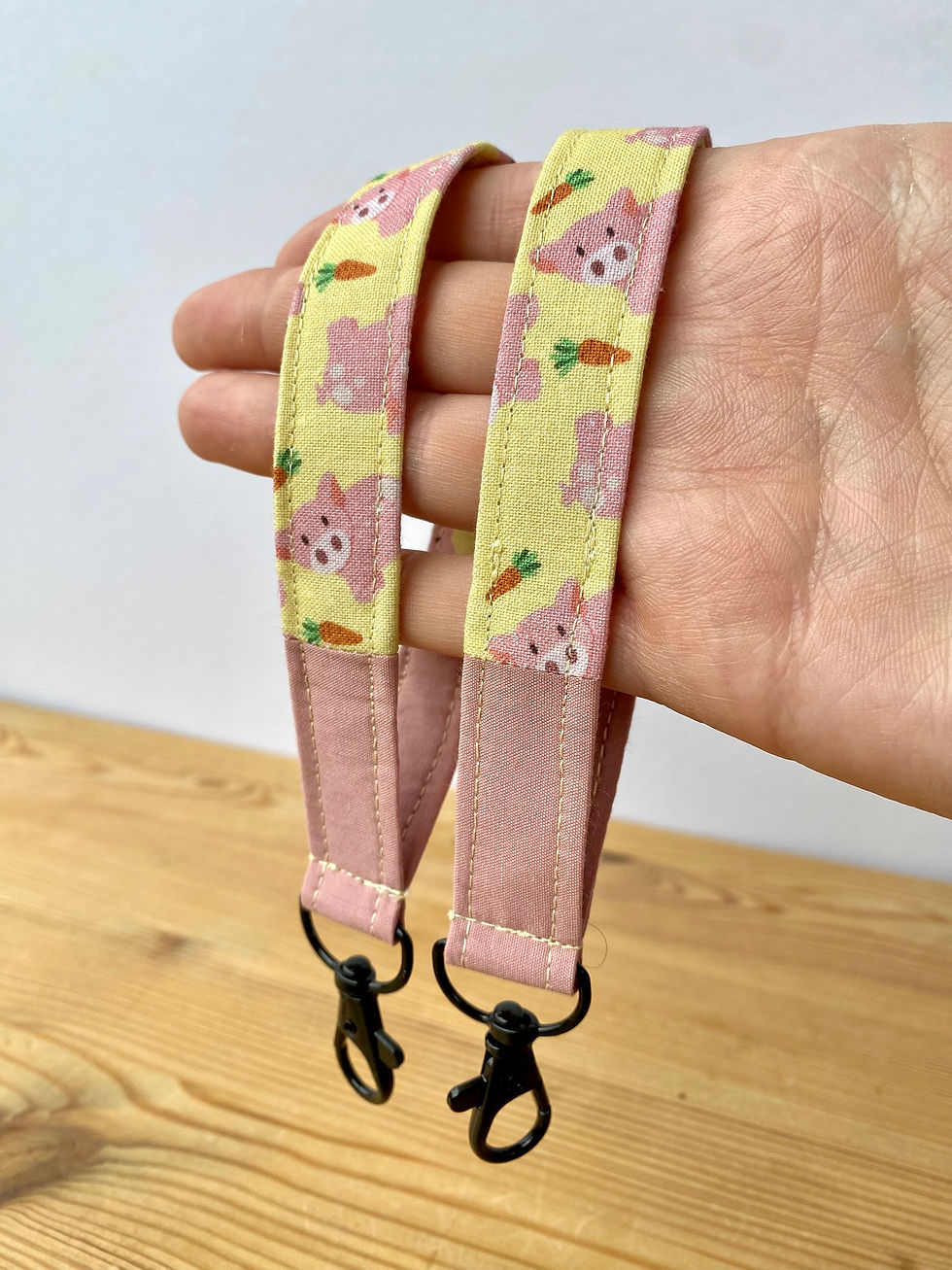 Thumbnail: Holding two pig wristlet, showing pig and carrots details