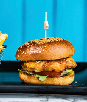 A hamburger and french fries on a table