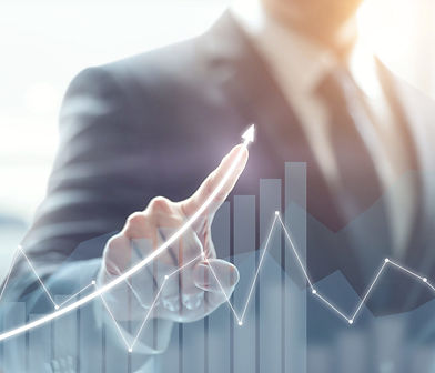 business man pointing on a graphic increase sales