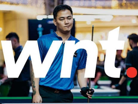 A photo of Johann Chua, a pool player, in the background at the Philippines Open, with the World Nineball Tour Logo on top in white. 