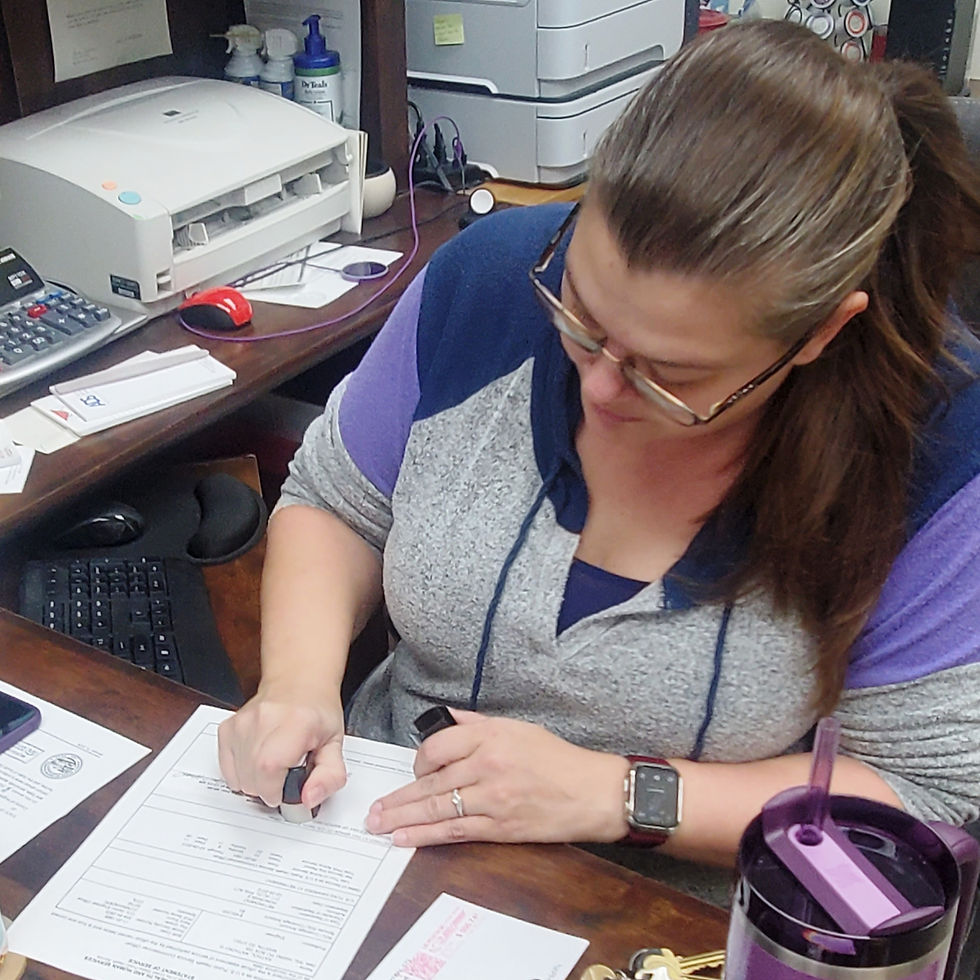 Bennett County Register Jaci Clifford affixes her official seal when recording the document, then signs it to make it official.