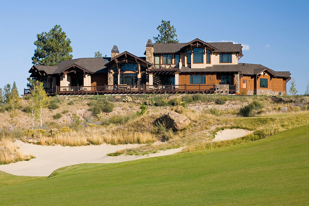 View from the golf course of this custom home in Tetherow