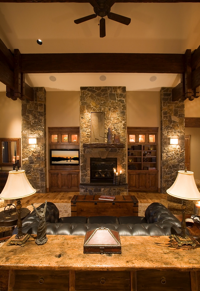 floor to ceiling stone fireplace with custom wood fireplace mantel design