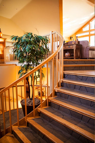traditional wooden stairs and railings in a home in Bend
