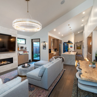 Main living area in a northwest contemporary custom home in Bend with dining, living, and kitchen view - PGC Building + Design