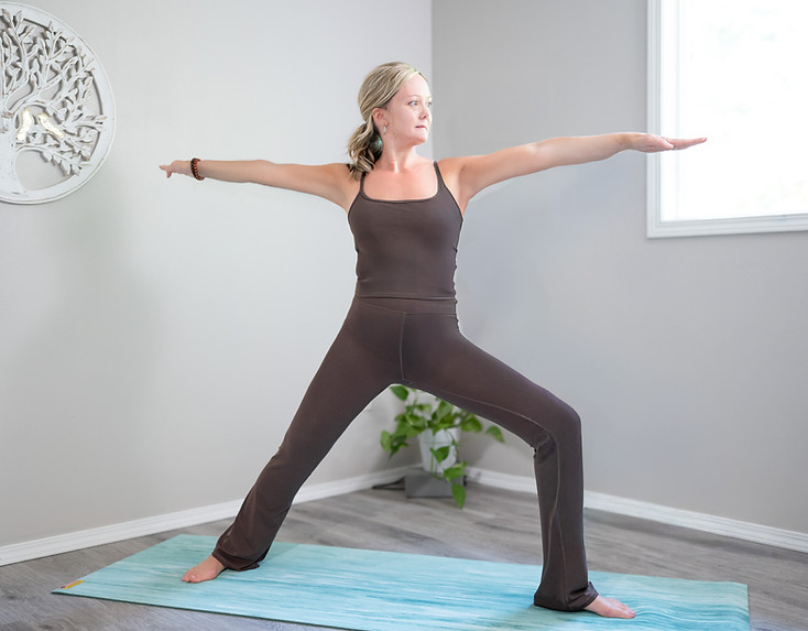 Vital Yogis founder posing in warrior pose.