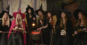 Photo of a large group of women dressed as witches, an example of our Bachelorette experience
