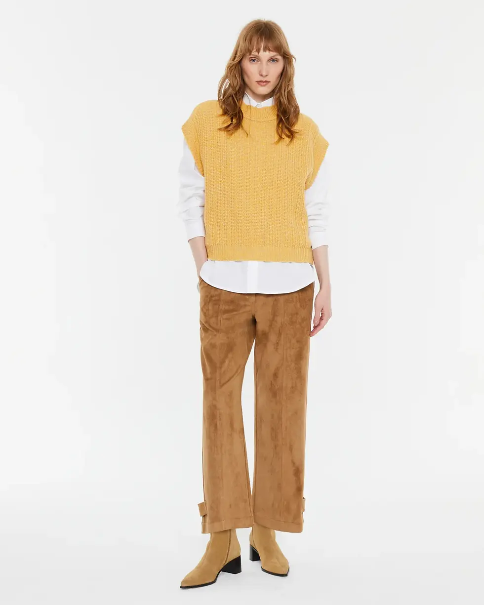 Full-length front view of the Andam knit vest in soft mustard on the model