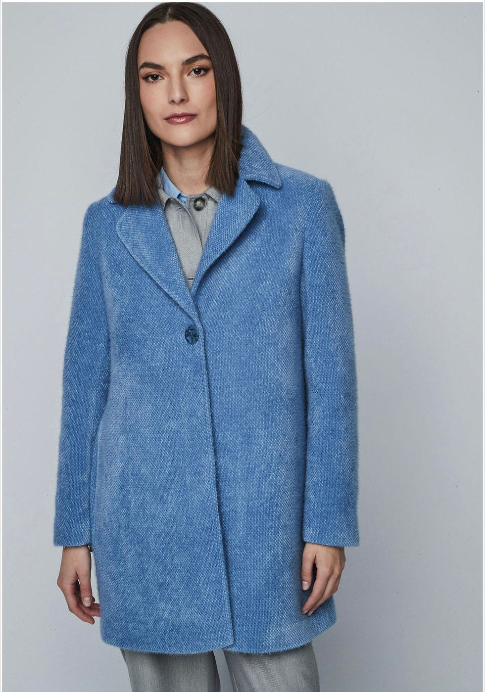 Close-up view: Detailed front view of the Dandara Skyla short coat, highlighting the textured fabric and structured lapels.