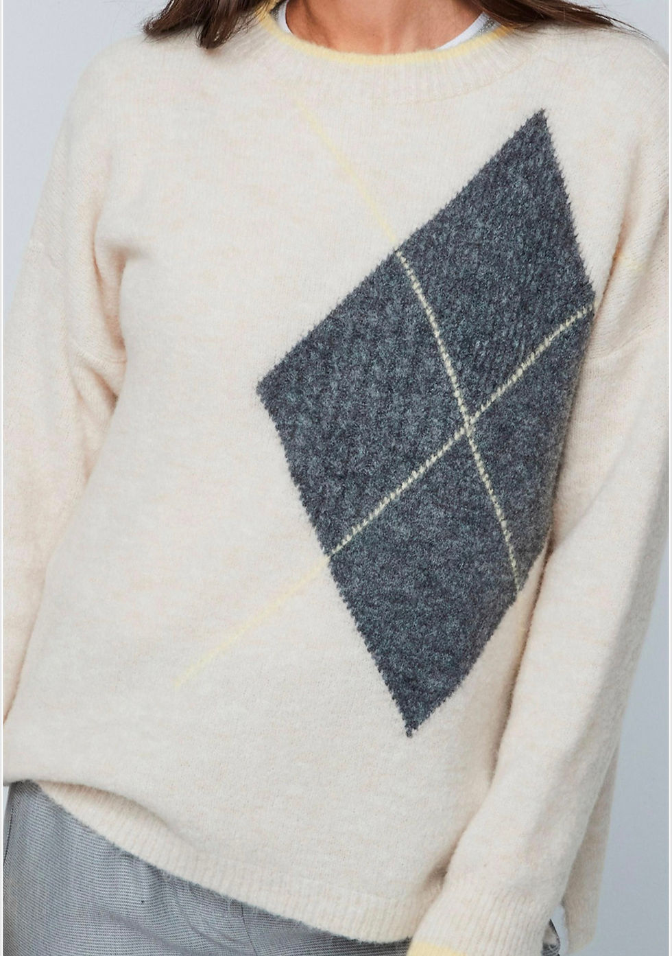 Close-up view of the soft knit jumper on the model