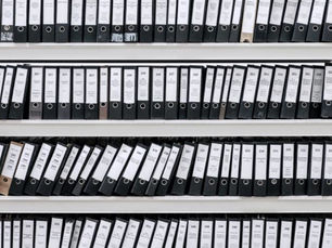 Two shelves with Corporate Binders