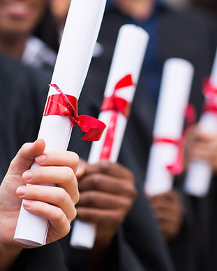 Graduates Holding Diplomas