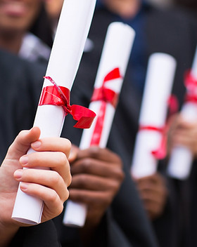 Graduates Holding Diplomas