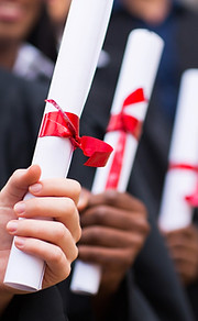 Graduates Holding Diplomas